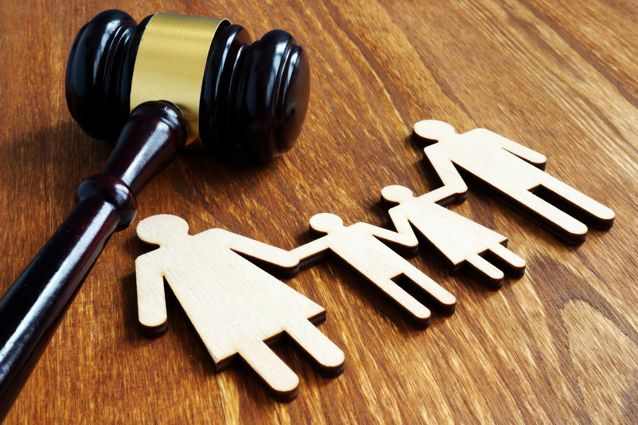 Family law concept. Wooden figures and gavel.